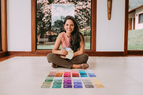Woman Sitting on the Floor with Color Samples 