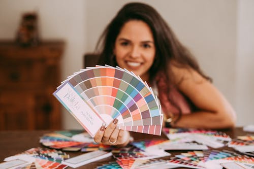 Woman Holding a Palette of Colors 