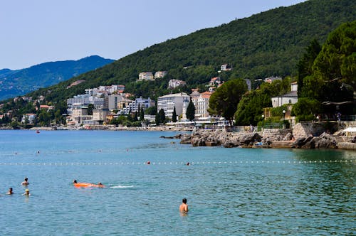 Photo of People Swimming on Resort