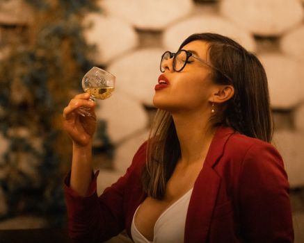 Sexy Woman in Red Blazer Holding a Snifter