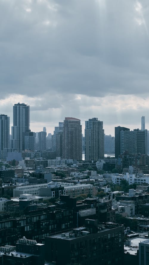 Cloudy Sky over High-rise Buildings