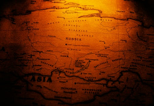 Close-up of a sepia toned vintage map highlighting Russia and Siberia.