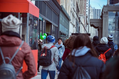 People Walking on Sidewalk