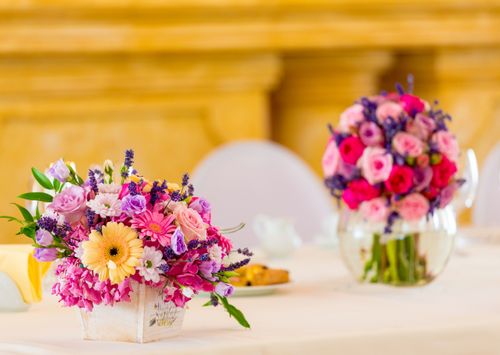 Free A beautiful bouquet of pastel flowers on a table, perfect for weddings or romantic occasions. Stock Photo