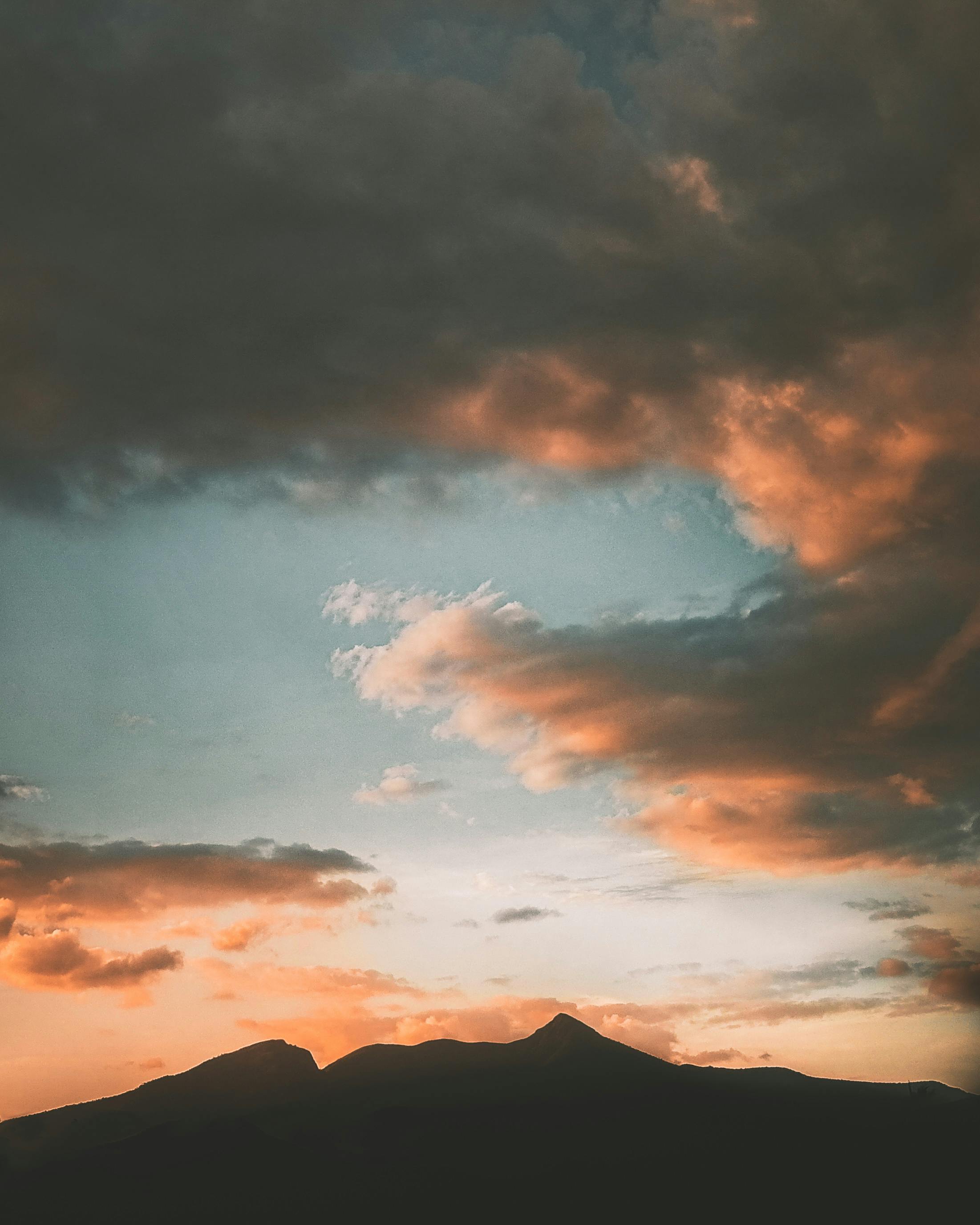 Close-up of a person examining engagement ring and nails together