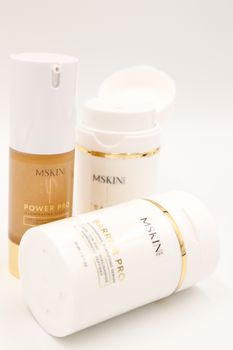 Elegant skincare bottles featuring premium serums and creams in a minimal setup.