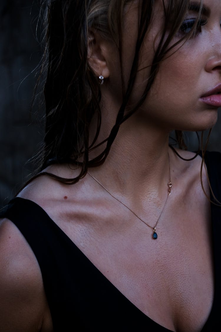 A Sweaty Woman With Necklace 