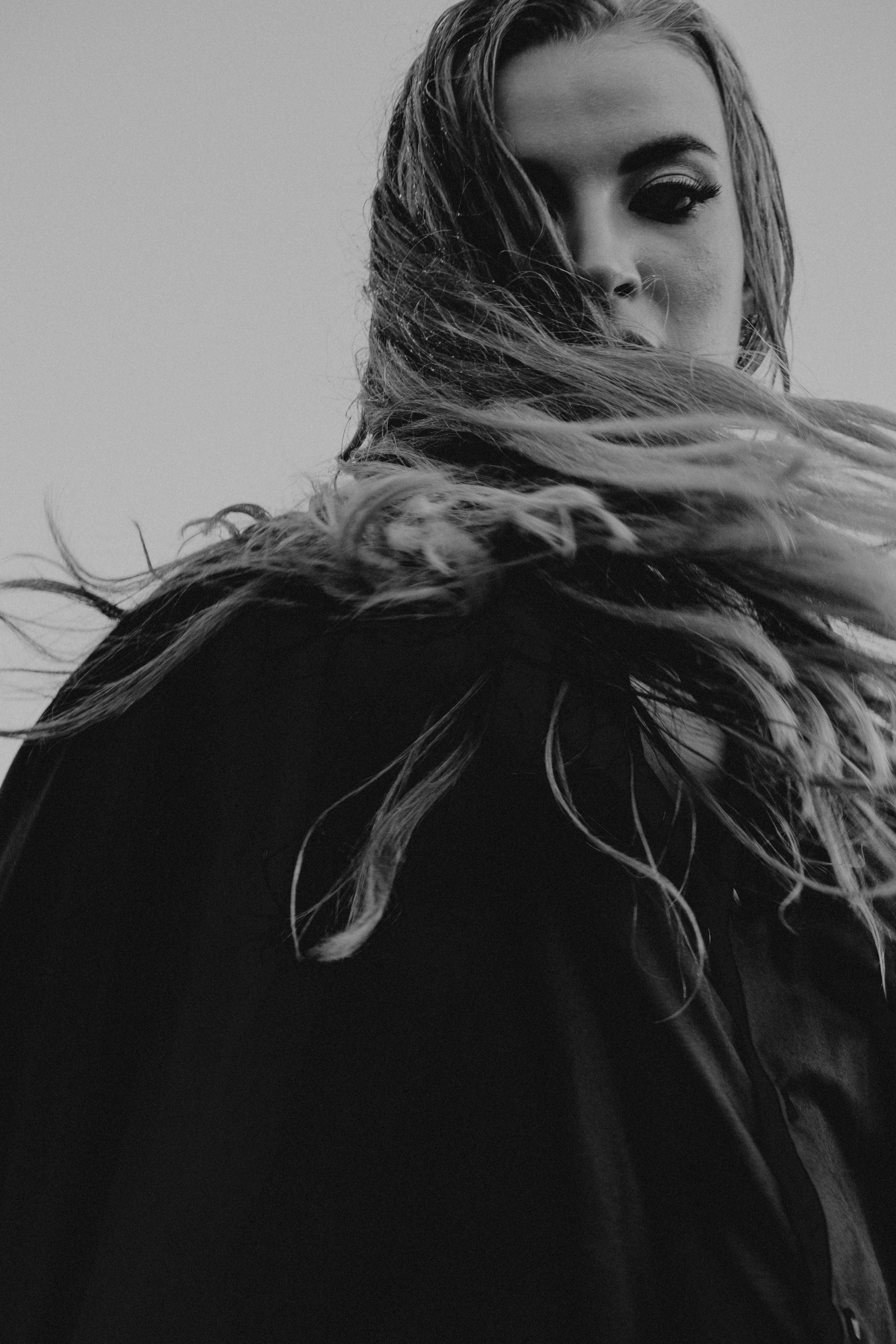 A Woman with Her Hair Flying in the Wind · Free Stock Photo