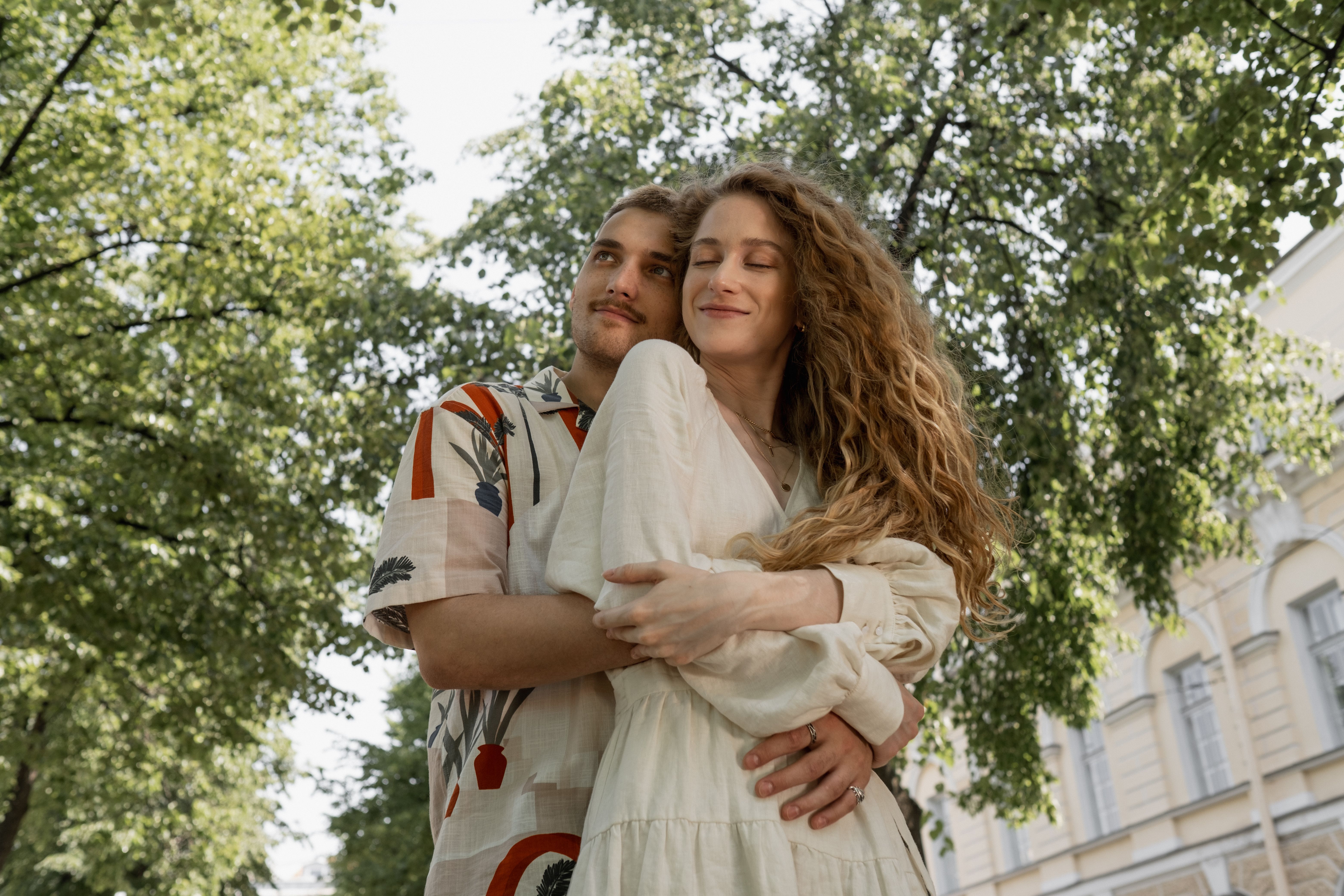 Man Hugging a Woman From Behind · Free Stock Photo
