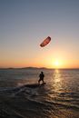 Silhouette of Man Fishing on Sea during Sunset