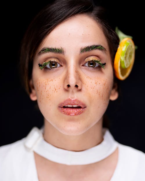 A Beautiful Woman with Seeds on Face