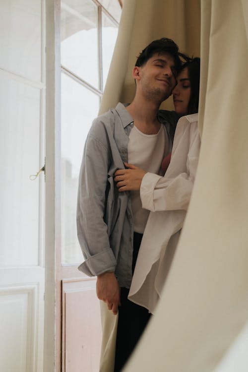 Free A Couple Hugging with Their Eyes Closed Stock Photo