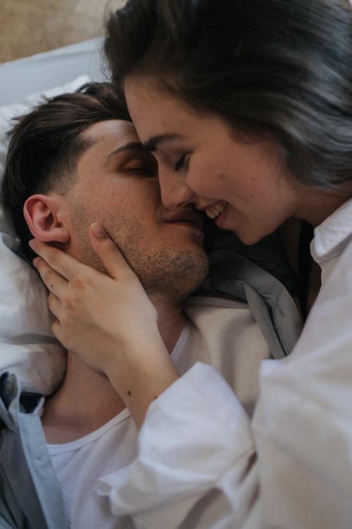 Free Passionate couple sharing a tender embrace and kiss, capturing love and intimacy. Stock Photo