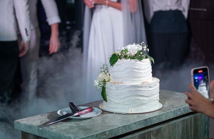 A Wedding Cake On A Marble Table