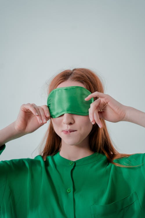 Free Close Up Photo of Woman Wearing Green Sleep Mask Stock Photo
