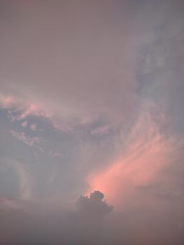 Serene evening sky with pastel pink clouds, evoking tranquility and calmness.