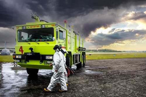 Free Firefighters walking Beside a Truck Stock Photo