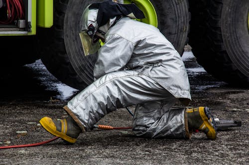 Firefighter Kneeling on the Floor