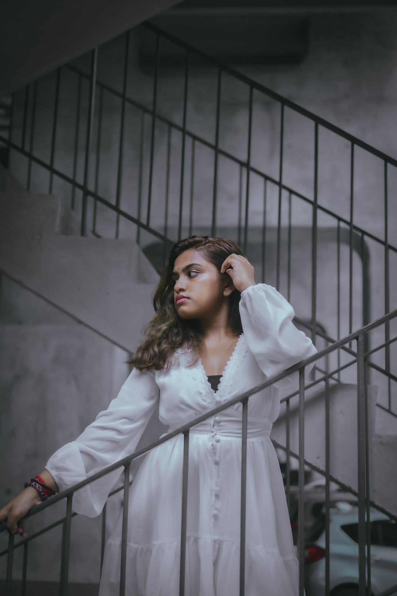 Woman wearing a white long-sleeve wrap dress, an easy one-piece business casual dress outfit