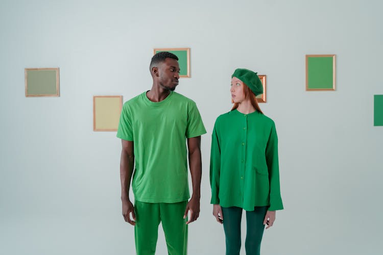 Couple Wearing Green Clothes In Art Gallery 