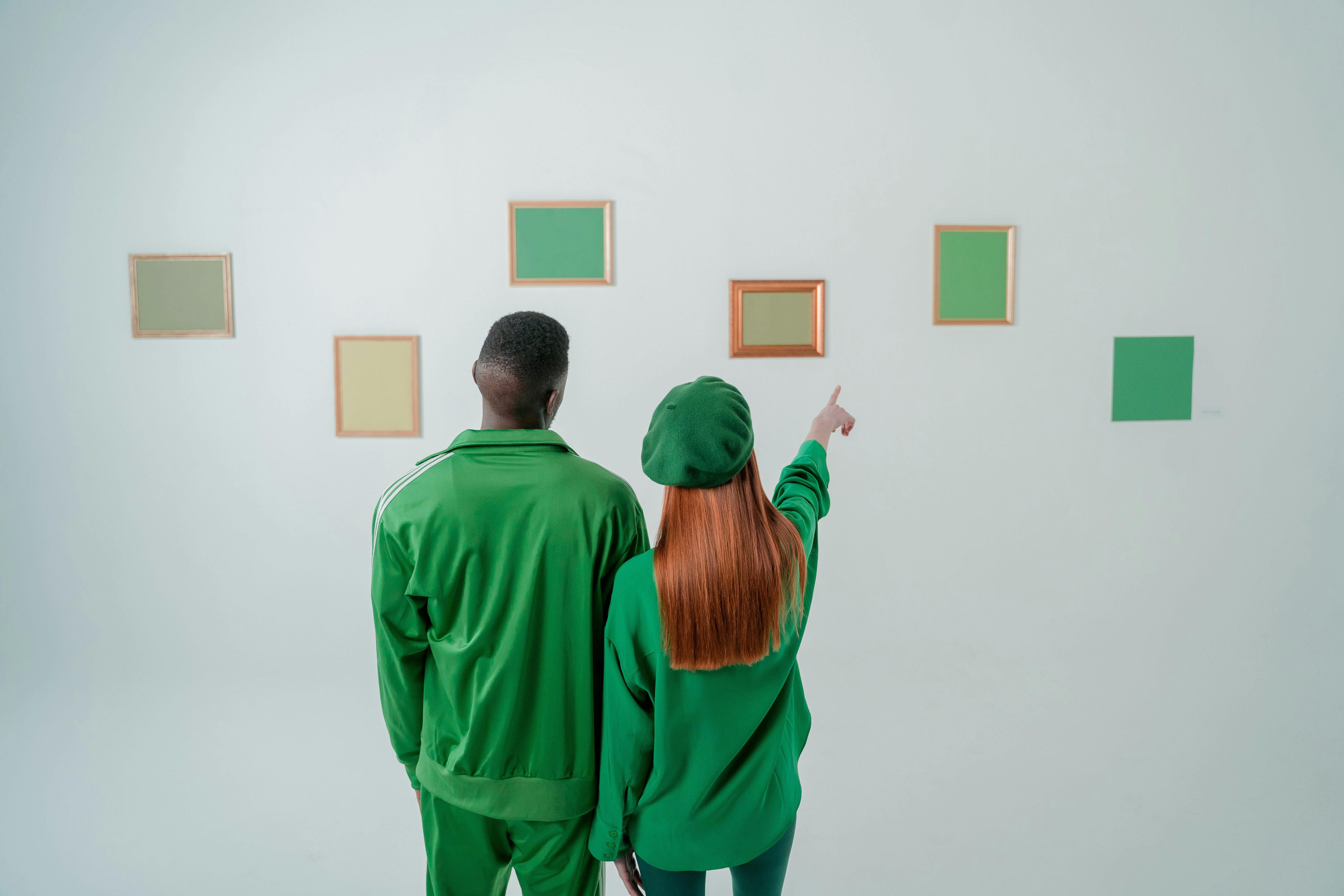 couple wearing green clothes in art gallery