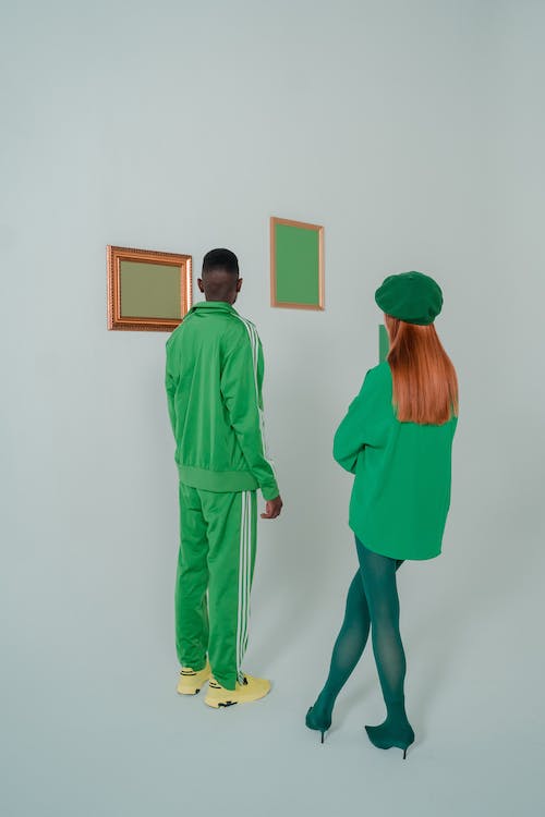 Couple Wearing Green Clothes in Art Gallery 