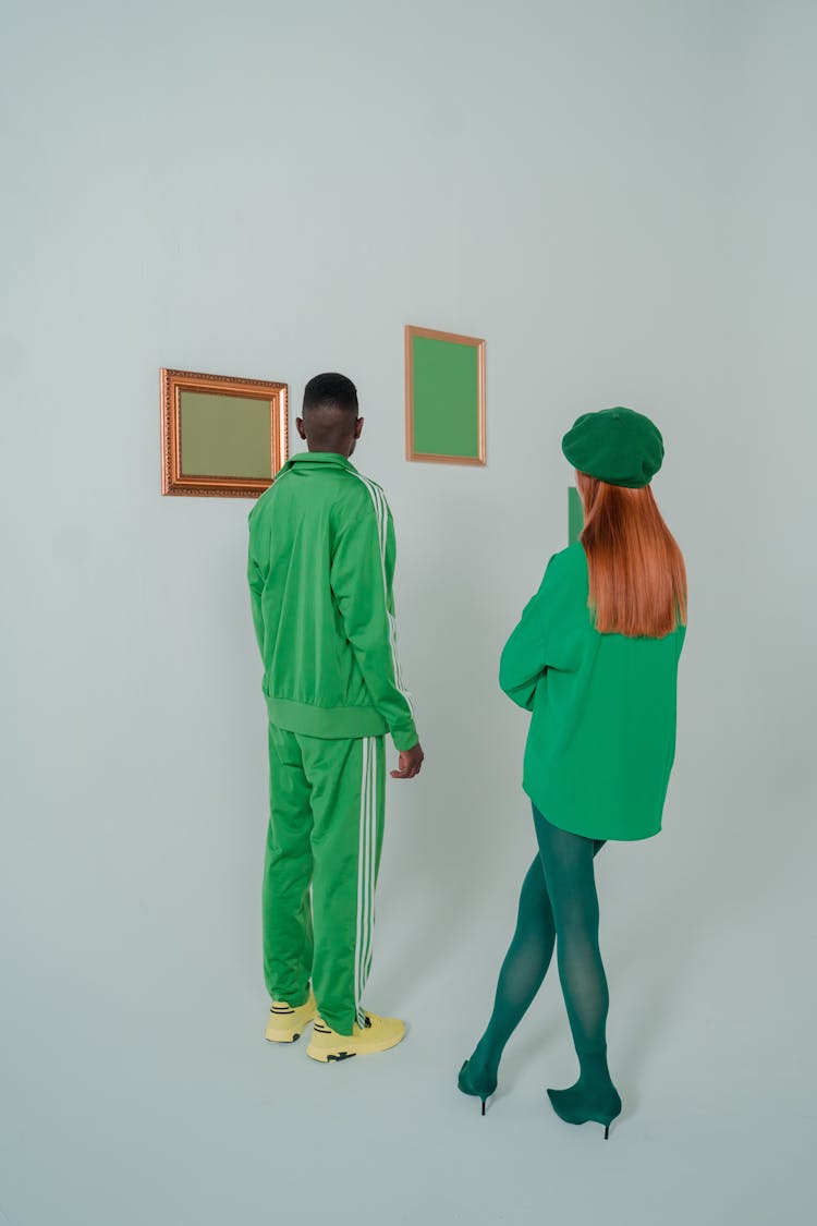 Couple Wearing Green Clothes In Art Gallery 