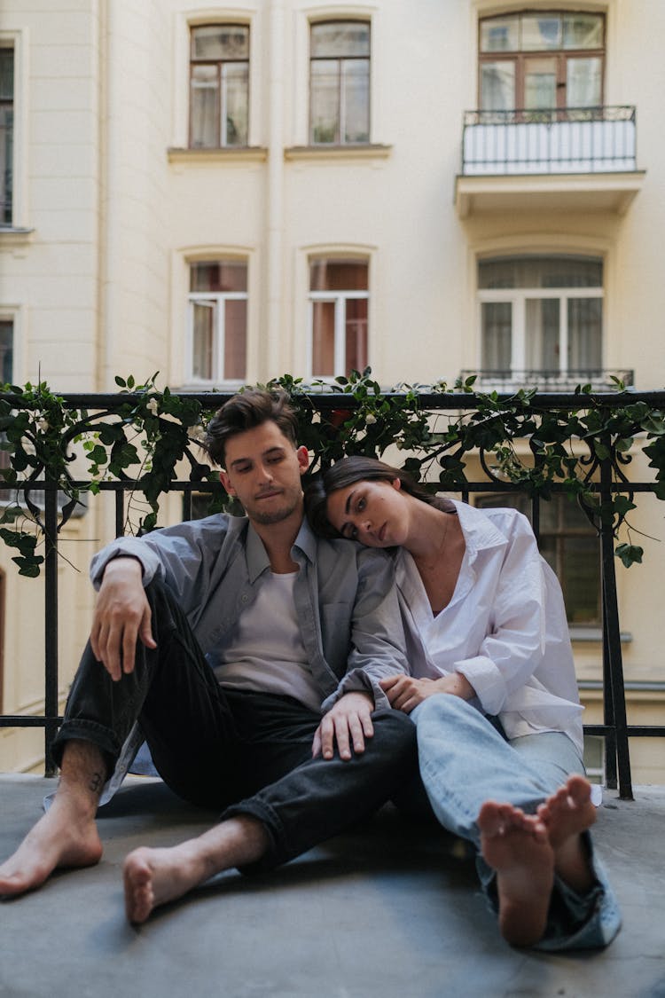 Couple Sitting On The Floor