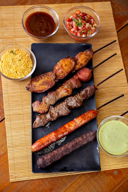 Traditional Meat Dish with Sauces on Table