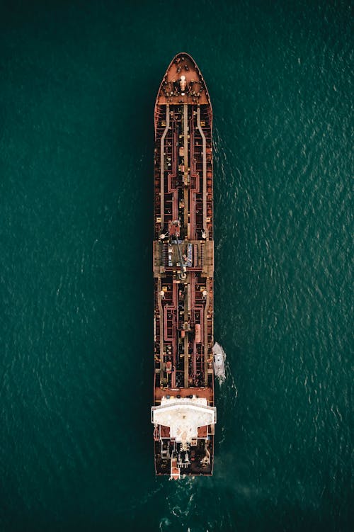 Free Drone Shot of a Vessel Sailing in the Sea Stock Photo