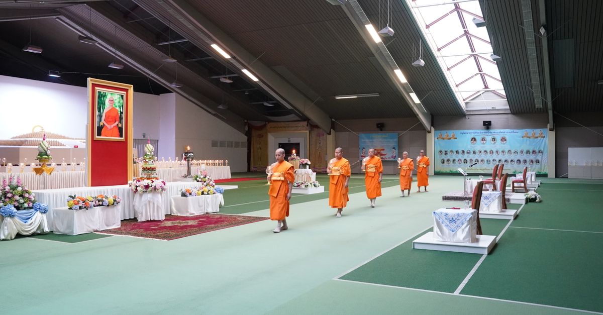 A peaceful meditation hall at a Vietnamese Buddhist monastery with sunlight streaming through windows