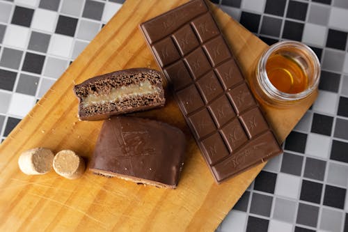Brown Chocolate Bars on Brown Wooden Chopping Board