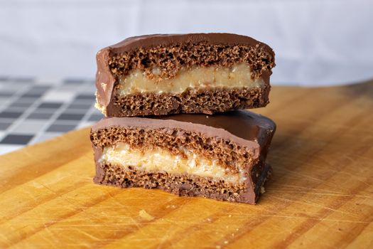 Slices of Chocolate Fudge Cake on Wooden Chopping Board