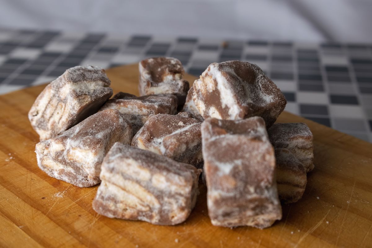 A close-up view of homemade traditional candies on a wooden board.