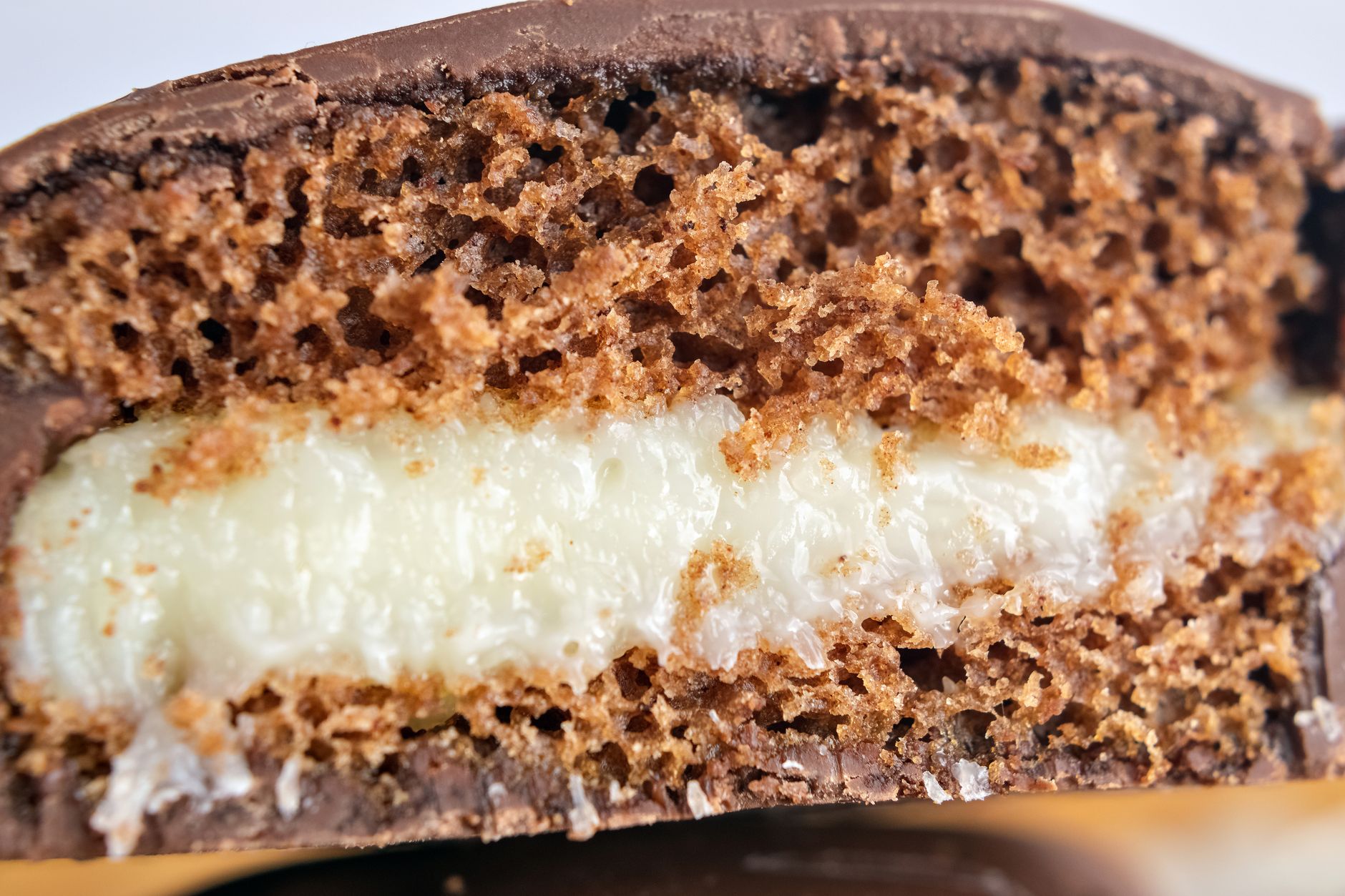 Close-up of moist mascarpone chocolate cake with honey cream filling