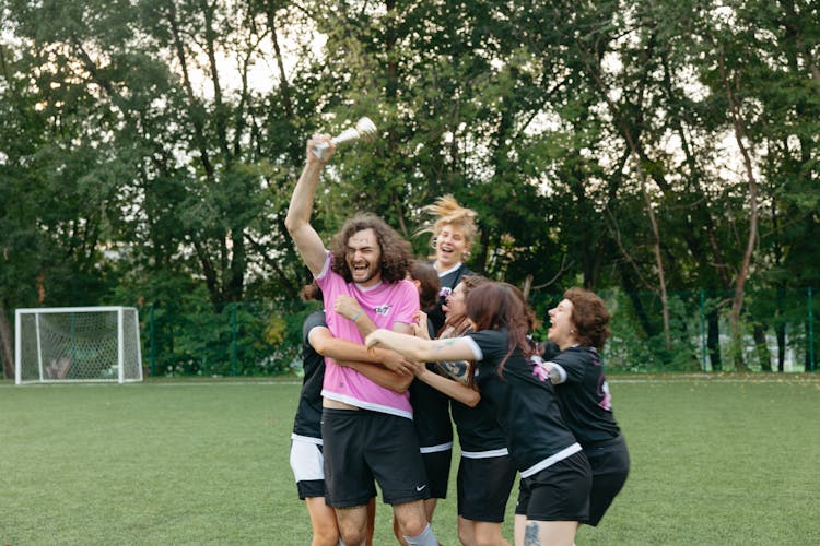 A Group Of Athletes Celebrating