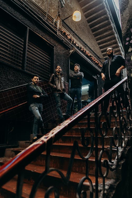 Low Angle Shot of Men Standing on Stairs