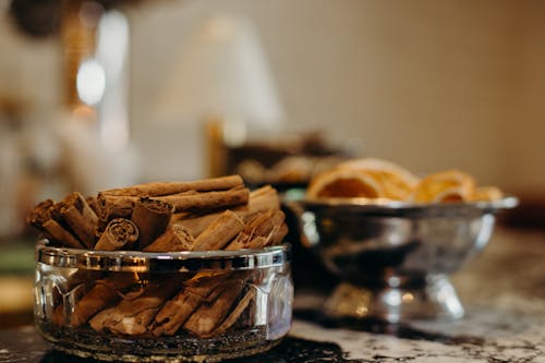 Brown Cinnamon Sticks on Clear Glass Container