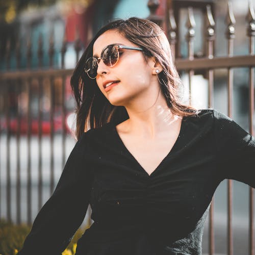A Beautiful Woman in Black Long Sleeve Shirt and Sunglasses