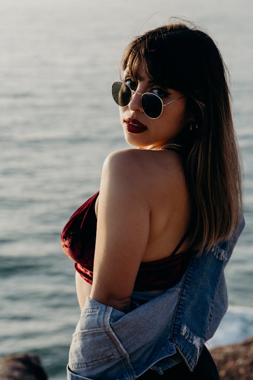 A Woman Wearing a Sunglasses Looking Back