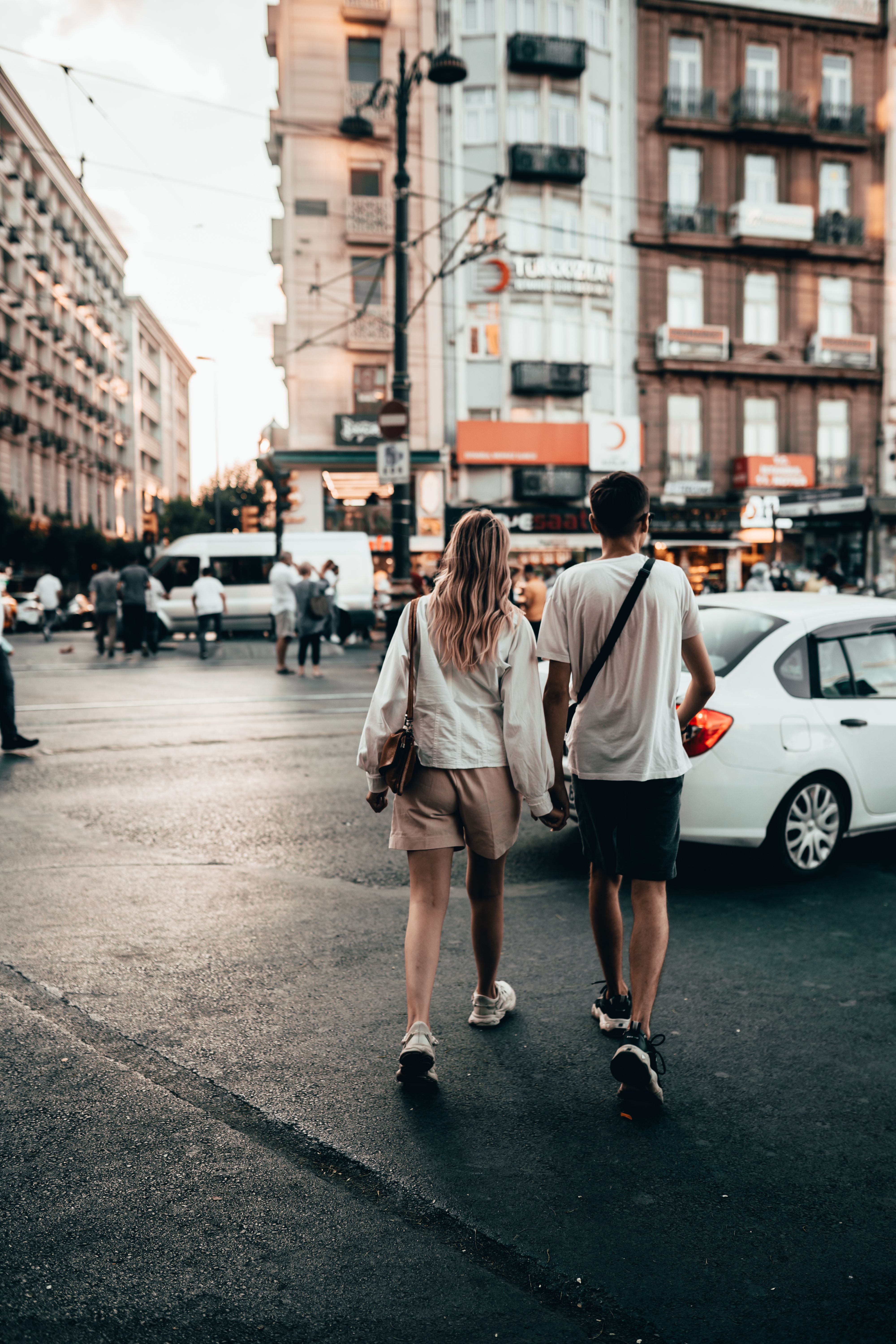 Back View of a Couple Walking on the Street Together · Free Stock Photo