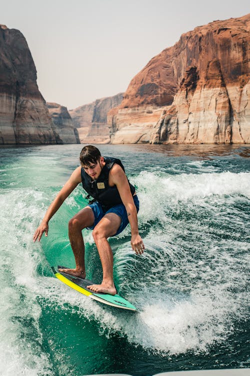 A Man Doing Surfboarding