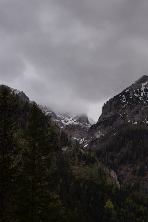 Thick Gray Clouds on Mountain Peaks