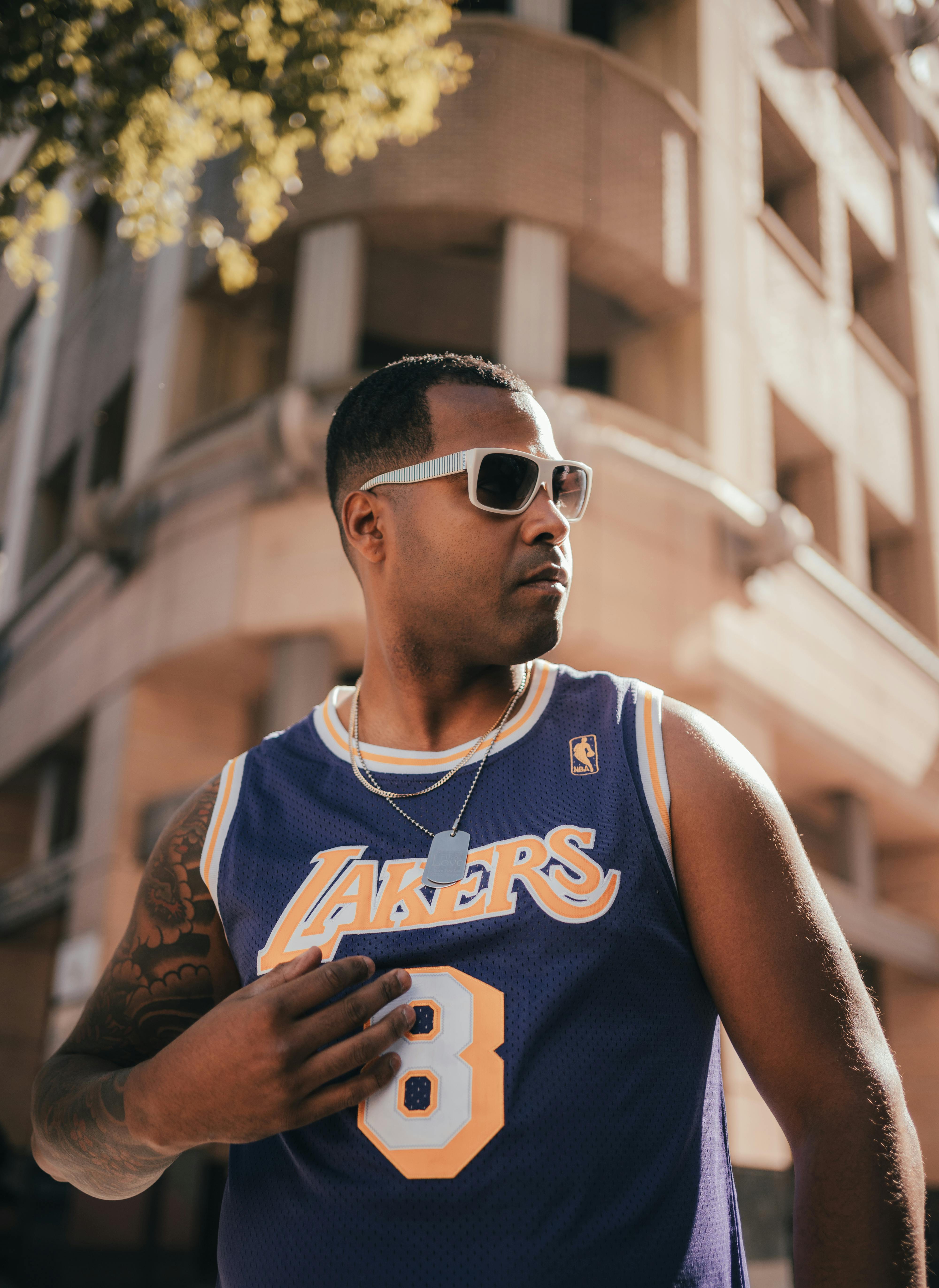 A Man in Sunglasses Wearing Lakers Jersey · Free Stock Photo