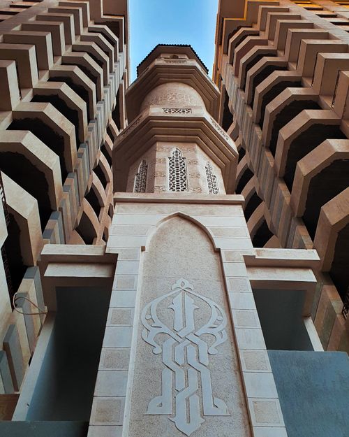 Free Capture the beauty of an architectural marvel with intricate designs and a striking low angle view. Stock Photo