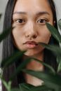 Girl in Red Lipstick Near Green Leaves