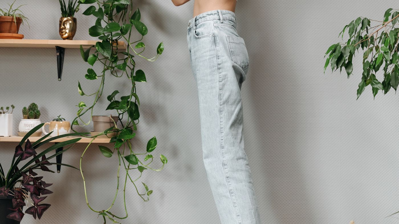 Watering potted plants in an indoor garden