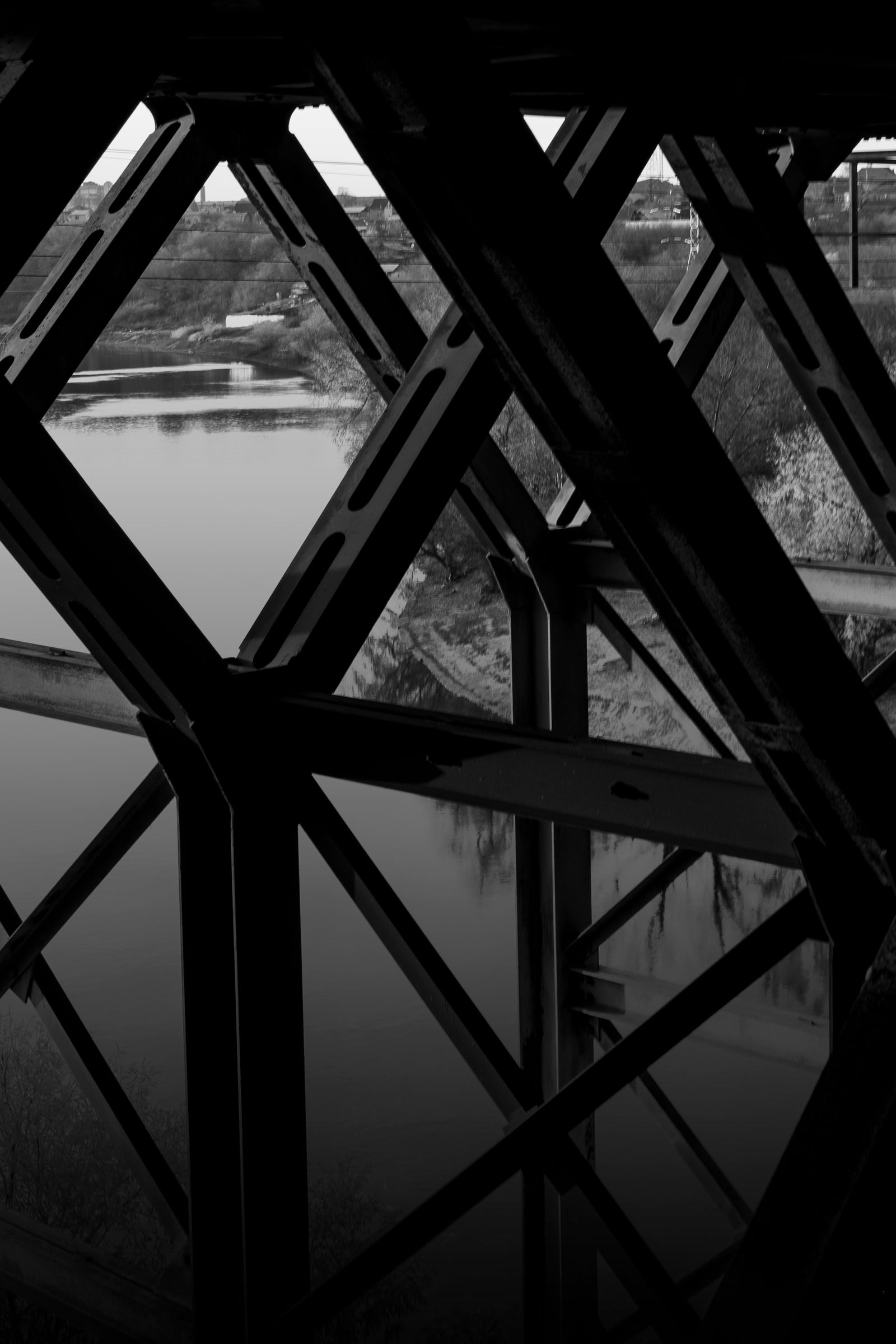 Steel structural members beneath a bridge