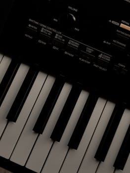 Detailed close-up of an electric piano keyboard and control panel, showcasing musical equipment intricacies.