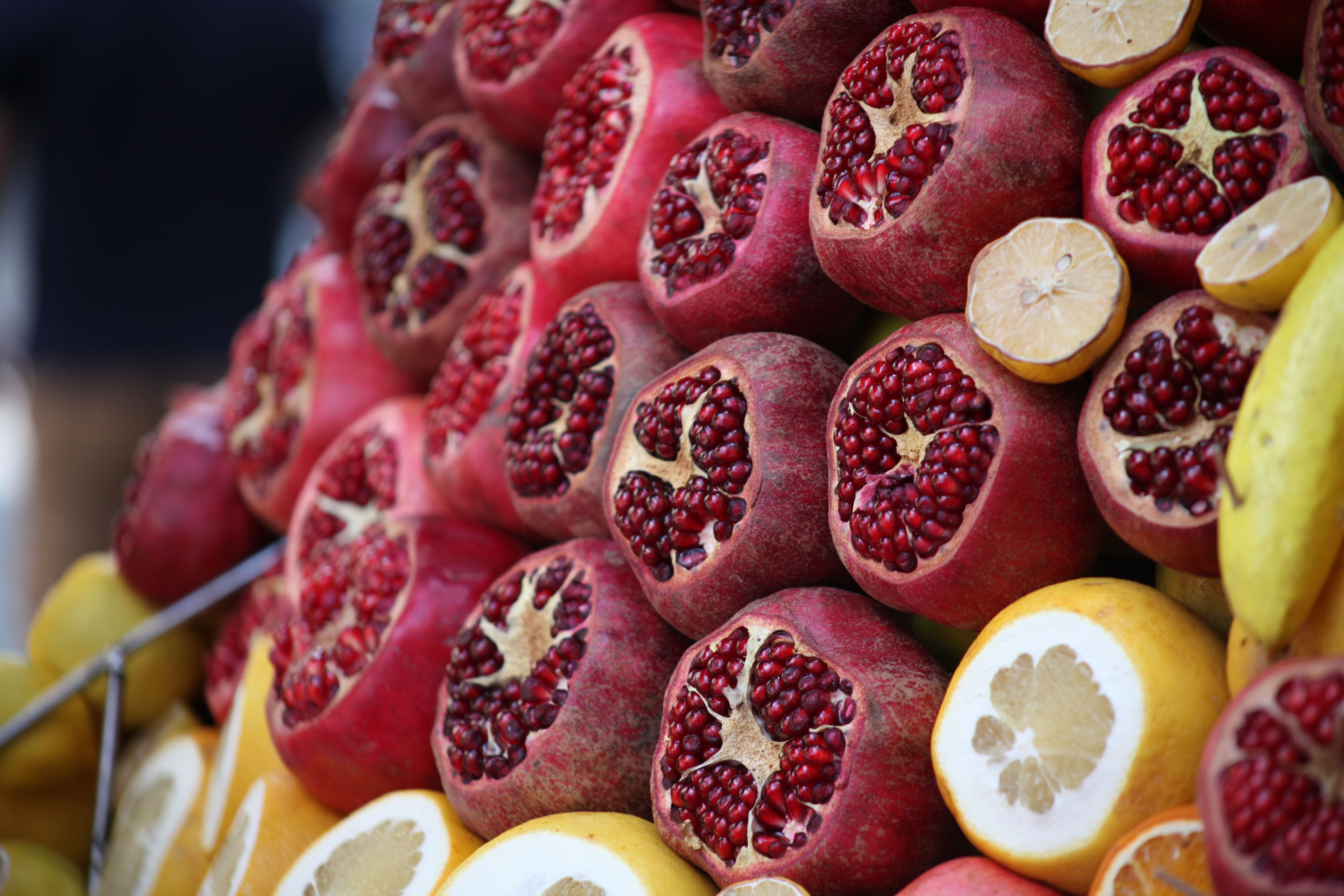 Freshly cut pomegranates and lemons on display at a market stall in Istanbul, Turkey.